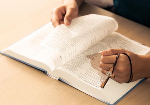 A man reading the Bible, who is part of a study group with Second Chance at Life